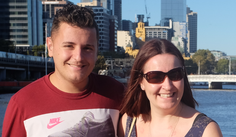 photo of Victoria and Max in Melbourne city, sky scrappers in the background