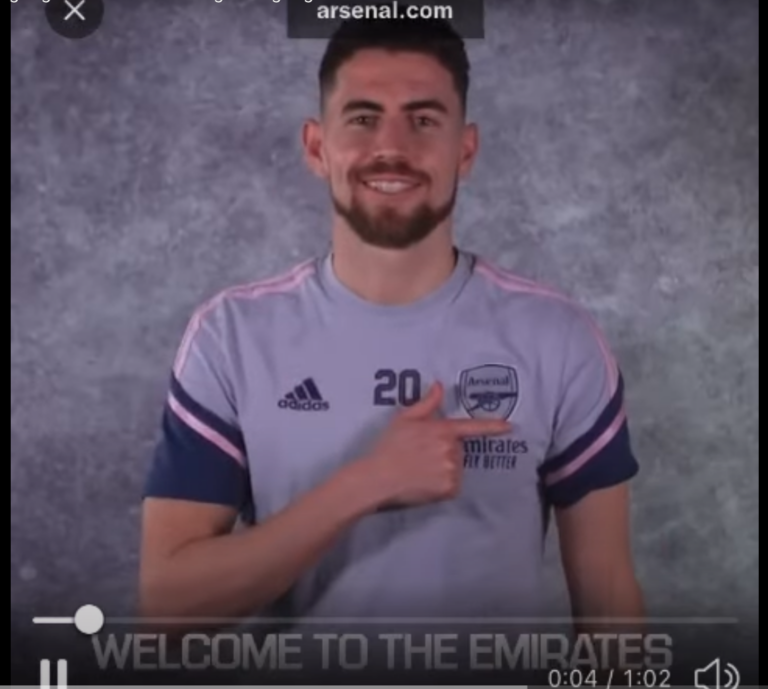 Image showing young man wearing Arsenal t-shirt and signing Arsenal