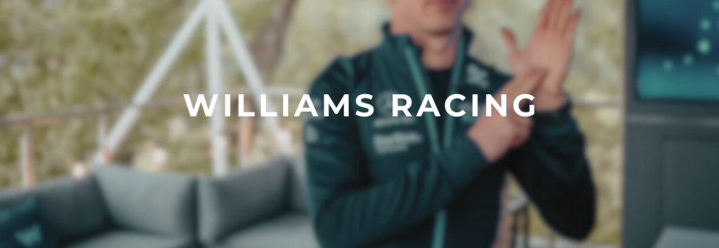 Blurred imahge of signing man with white font text of Williams Racing
